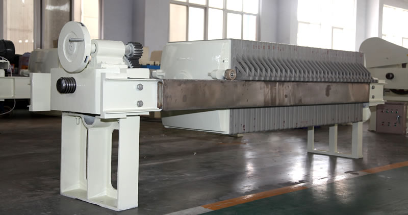 There is one manual filter press on the picture, with three main components: frame, filtering parts and pressing device.
